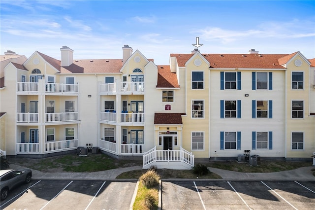 14721 Whitecap Blvd Unit 344, Corpus Christi, TX 78418 - view of building exterior with uncovered parking