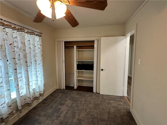230 Lola Johnson, Corpus Christi, TX 78418 - unfurnished bedroom featuring a closet, dark colored carpet, and ornamental molding