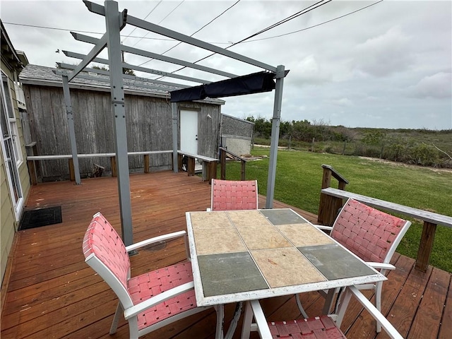 230 Lola Johnson, Corpus Christi, TX 78418 - wooden deck with outdoor dining area, a yard, and a pergola