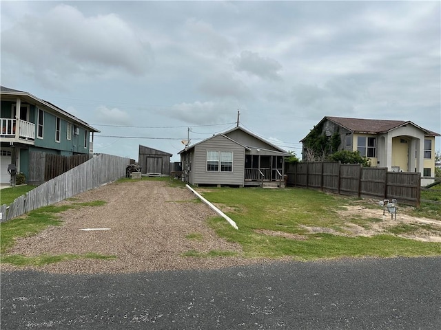 230 Lola Johnson, Corpus Christi, TX 78418 - view of yard with driveway and fence