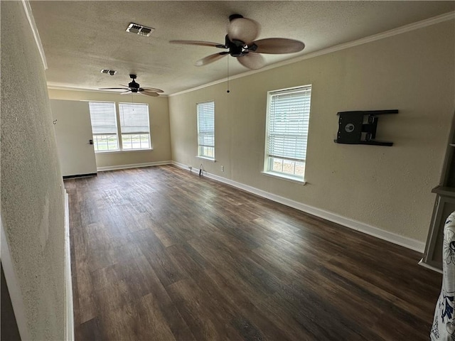 230 Lola Johnson, Corpus Christi, TX 78418 - unfurnished living room featuring a textured ceiling, visible vents, dark wood-type flooring, ceiling fan, and ornamental molding