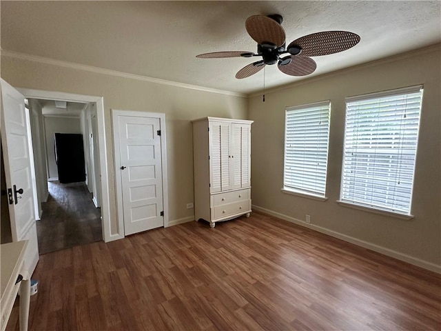 230 Lola Johnson, Corpus Christi, TX 78418 - unfurnished bedroom with wood finished floors, baseboards, and ornamental molding