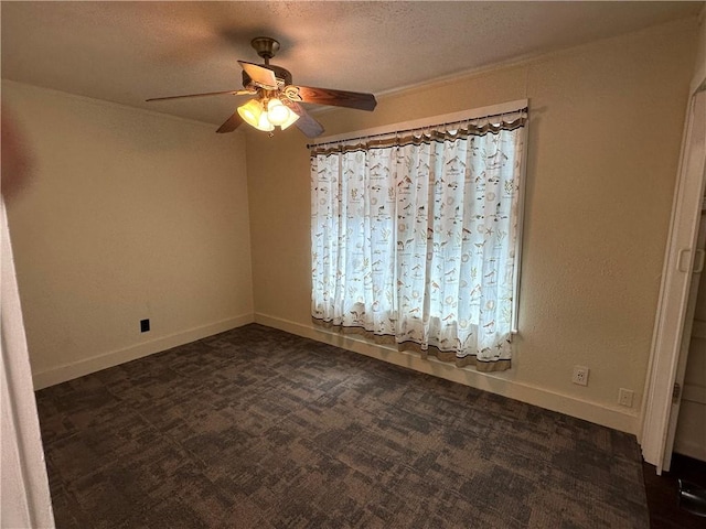 230 Lola Johnson, Corpus Christi, TX 78418 - unfurnished room featuring a ceiling fan, dark carpet, baseboards, and a textured ceiling