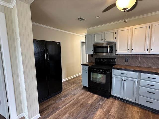 230 Lola Johnson, Corpus Christi, TX 78418 - kitchen with ornamental molding, visible vents, dark wood-type flooring, black appliances, and dark countertops