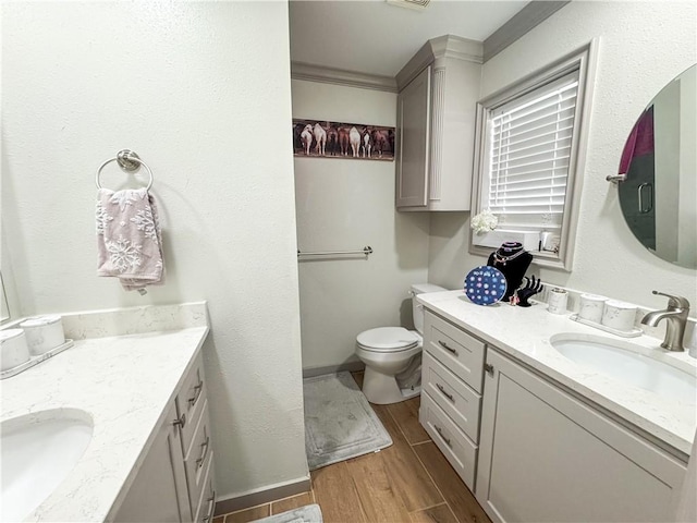 4625 Harney Rd, Corpus Christi, TX 78410 - bathroom featuring vanity, wood finished floors, and crown molding