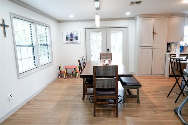 4625 Harney Rd, Corpus Christi, TX 78410 - dining area featuring ornamental molding, french doors, light wood finished floors, plenty of natural light, and recessed lighting