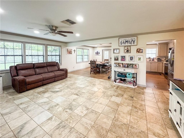 4625 Harney Rd, Corpus Christi, TX 78410 - living area featuring crown molding, a ceiling fan, recessed lighting, and light tile patterned flooring