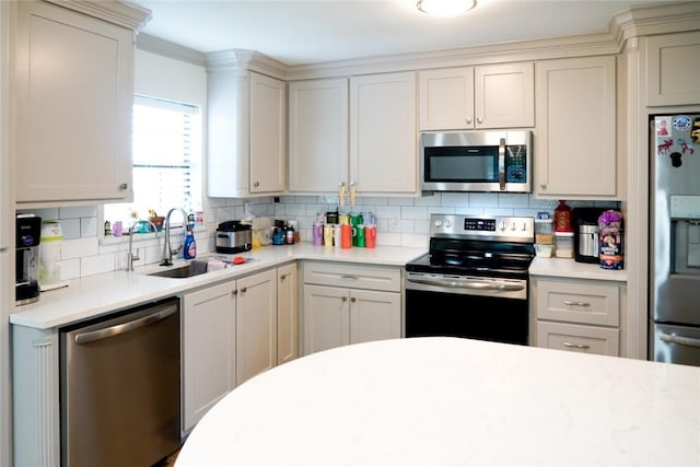4625 Harney Rd, Corpus Christi, TX 78410 - kitchen with appliances with stainless steel finishes, tasteful backsplash, and light countertops
