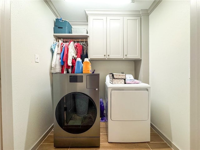 4625 Harney Rd, Corpus Christi, TX 78410 - laundry area featuring washer and dryer, cabinet space, and light wood-style flooring