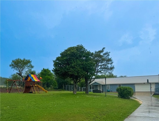 4625 Harney Rd, Corpus Christi, TX 78410 - view of green lawn featuring a playground and driveway