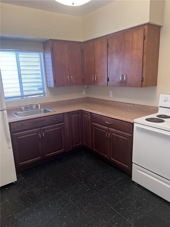 kitchen featuring sink and white appliances