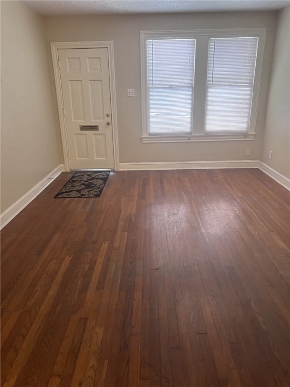 interior space with dark hardwood / wood-style flooring