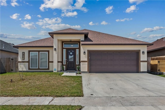 4133 Midlands St, Corpus Christi, TX 78414 - prairie-style house featuring an attached garage, concrete driveway, stucco siding, and roof with shingles