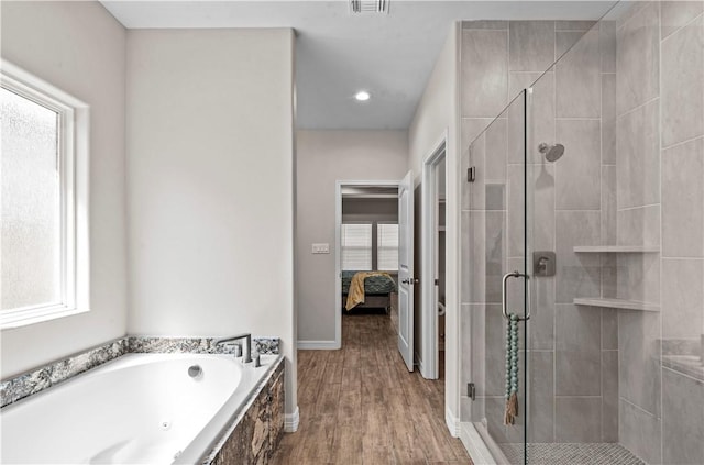 4133 Midlands St, Corpus Christi, TX 78414 - ensuite bathroom featuring a shower stall, a bath, wood finished floors, and recessed lighting