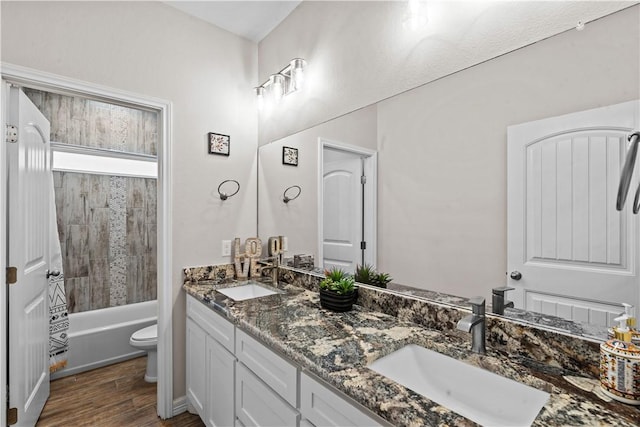 4133 Midlands St, Corpus Christi, TX 78414 - bathroom featuring double vanity, wood finished floors, and washtub / shower combination