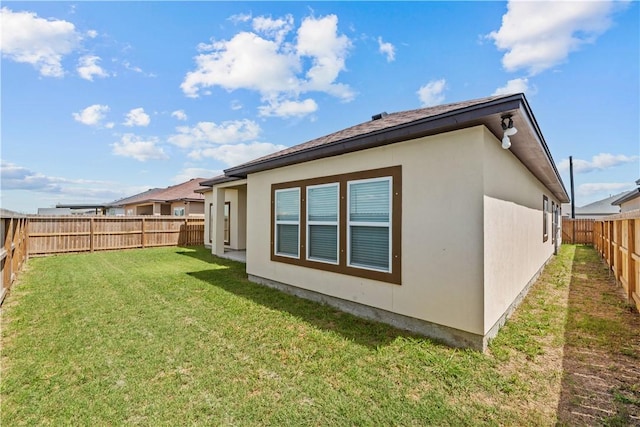 4133 Midlands St, Corpus Christi, TX 78414 - rear view of property featuring a fenced backyard and stucco siding