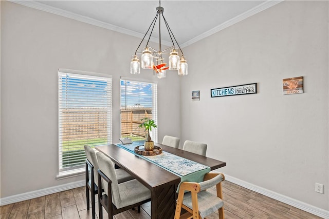 4133 Midlands St, Corpus Christi, TX 78414 - dining room featuring wood finished floors, a chandelier, and crown molding