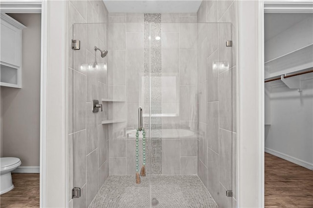 4133 Midlands St, Corpus Christi, TX 78414 - bathroom with a stall shower, a spacious closet, and wood finished floors