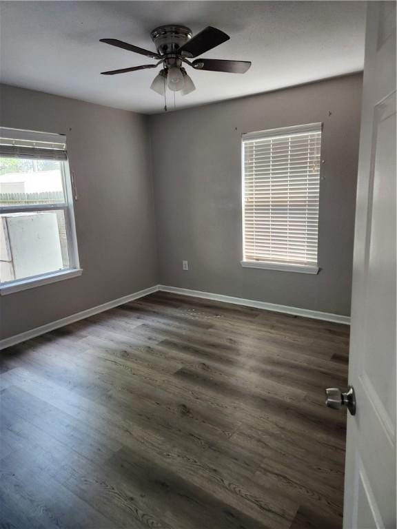 413 S 13th St, Aransas Pass, TX 78336 - empty room with a ceiling fan, dark wood finished floors, and baseboards