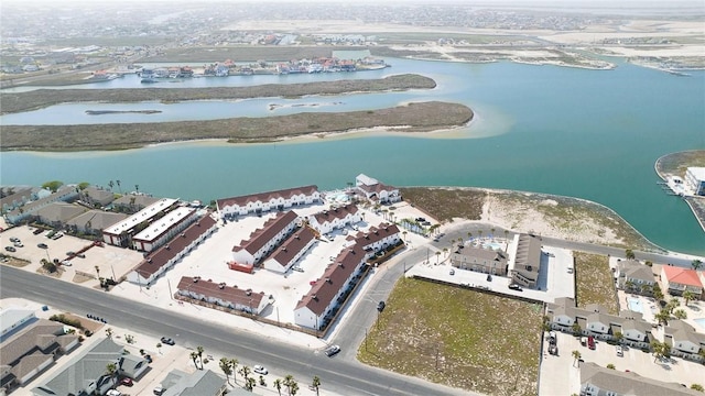 aerial view featuring a water view and a view of the beach