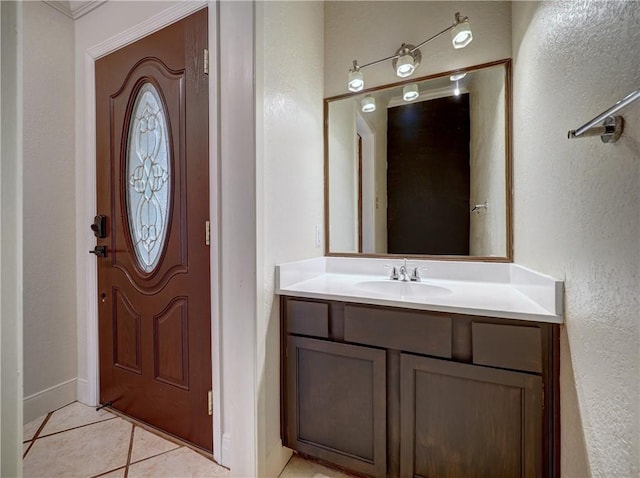 bathroom with tile patterned flooring and vanity