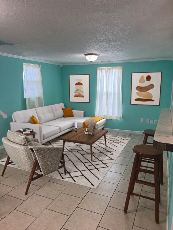 living room featuring crown molding, light tile patterned floors, and a textured ceiling