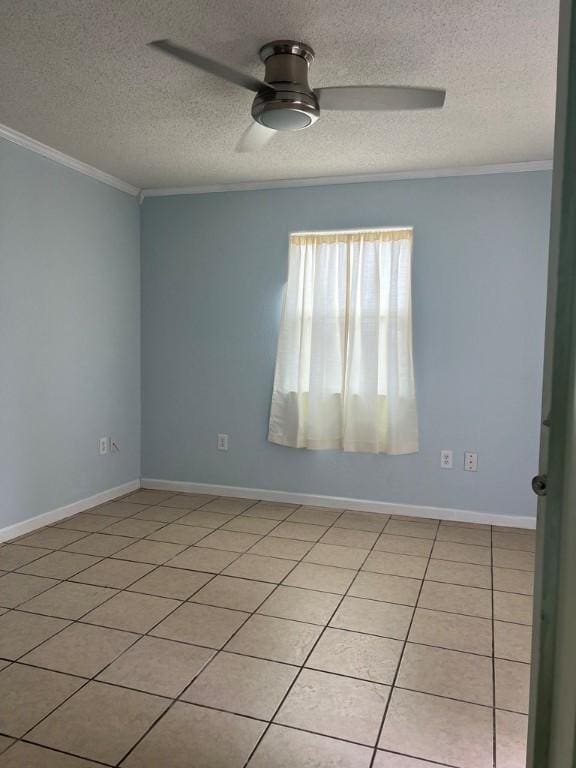 unfurnished room featuring ceiling fan, light tile patterned flooring, crown molding, and a textured ceiling