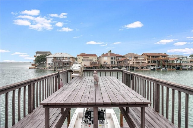 13514 King Phillip Ct, Corpus Christi, TX 78418 - dock featuring a residential view, outdoor dining space, and a deck with water view