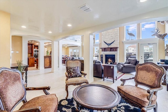 13514 King Phillip Ct, Corpus Christi, TX 78418 - living room with arched walkways, plenty of natural light, light tile patterned flooring, and recessed lighting