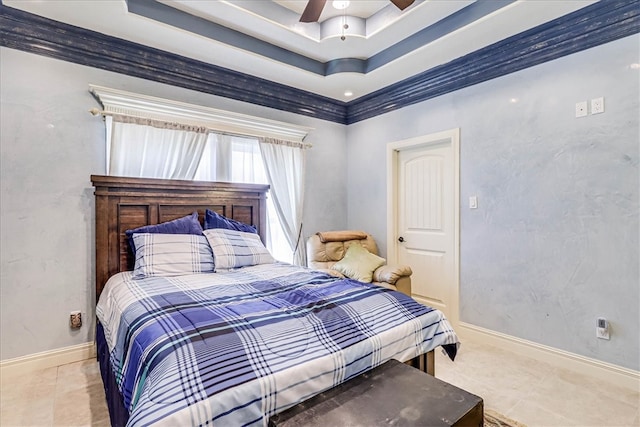 bedroom featuring ceiling fan, crown molding, a tray ceiling, and light tile patterned floors