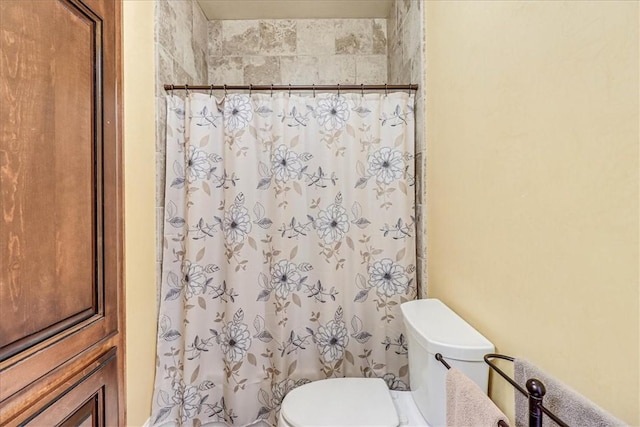 13514 King Phillip Ct, Corpus Christi, TX 78418 - bathroom with toilet and a shower with shower curtain