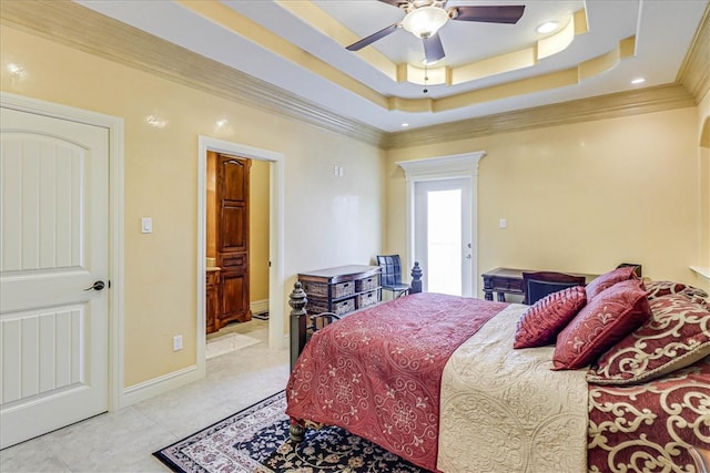 bedroom featuring light tile patterned floors, ceiling fan, a tray ceiling, and ornamental molding