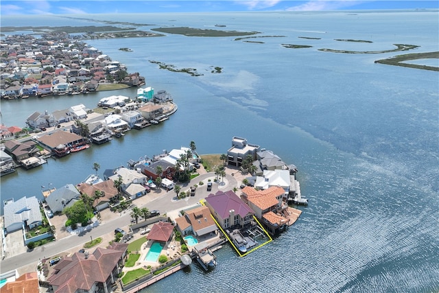 birds eye view of property featuring a water view