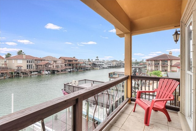 balcony featuring a water view