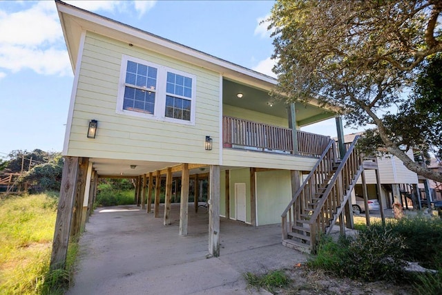 rear view of house with a carport