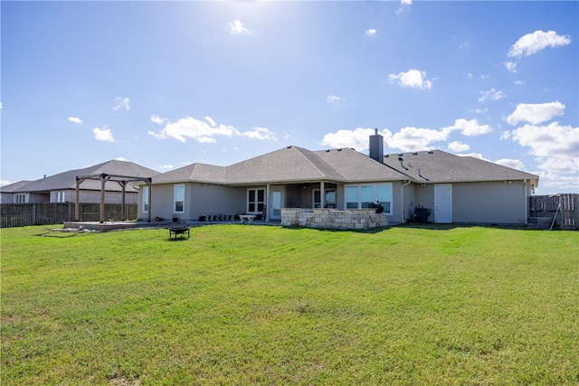 rear view of property with a patio area and a yard