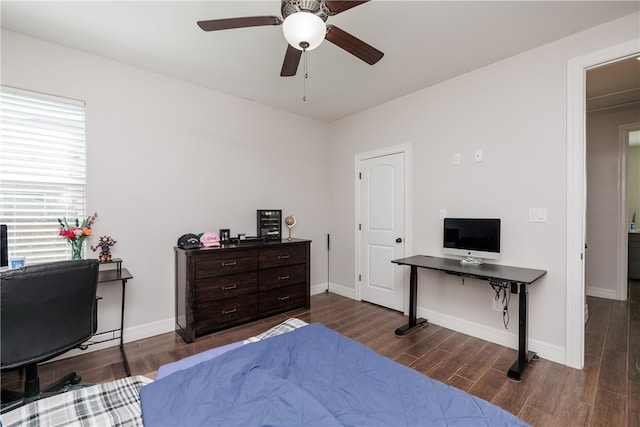 bedroom with ceiling fan and dark hardwood / wood-style flooring