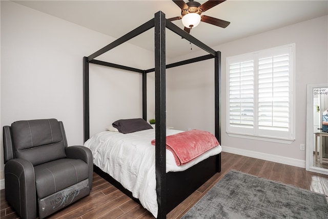 bedroom featuring ceiling fan and dark wood-type flooring