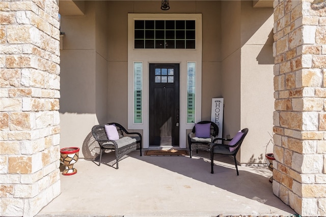 doorway to property featuring a patio area