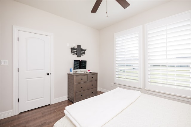 bedroom with ceiling fan and dark wood-type flooring