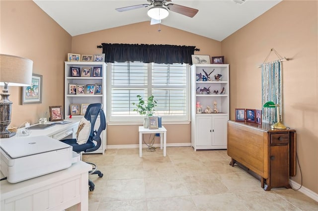 office featuring baseboards, a ceiling fan, vaulted ceiling, and tile patterned flooring