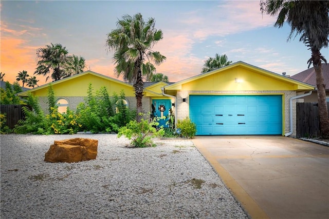 15718 Escapade St, Corpus Christi, TX 78418 - single story home featuring driveway, brick siding, and an attached garage