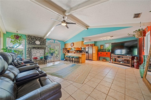 15718 Escapade St, Corpus Christi, TX 78418 - living room featuring a textured ceiling, a ceiling fan, and light tile patterned flooring
