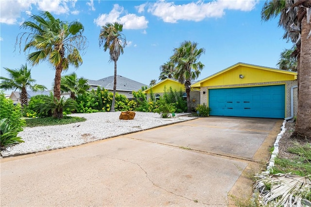 15718 Escapade St, Corpus Christi, TX 78418 - single story home with a garage, concrete driveway, and brick siding