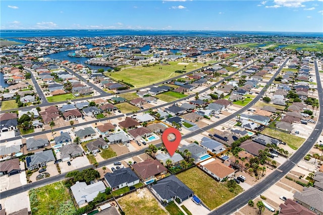 15718 Escapade St, Corpus Christi, TX 78418 - aerial view of property and surrounding area featuring nearby suburban area and a nearby body of water