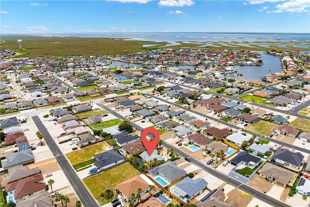 15718 Escapade St, Corpus Christi, TX 78418 - aerial view of property's location featuring a nearby body of water and nearby suburban area