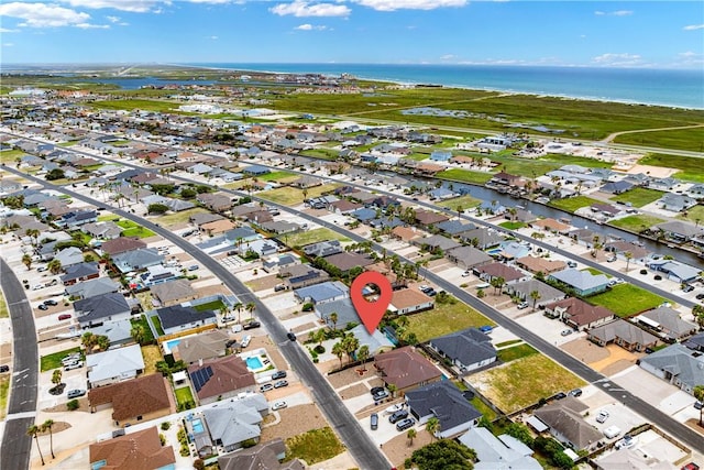 15718 Escapade St, Corpus Christi, TX 78418 - aerial view of property's location with nearby suburban area and a large body of water