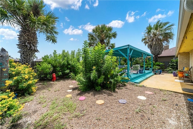 15718 Escapade St, Corpus Christi, TX 78418 - view of yard featuring a patio