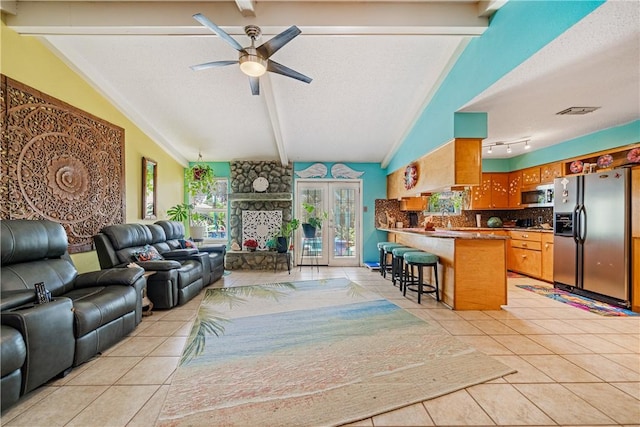 15718 Escapade St, Corpus Christi, TX 78418 - living area with a textured ceiling, light tile patterned floors, and a ceiling fan