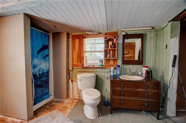 1162 N Sh 95, Bastrop, TX 78602 - bathroom with toilet, wooden ceiling, and vanity